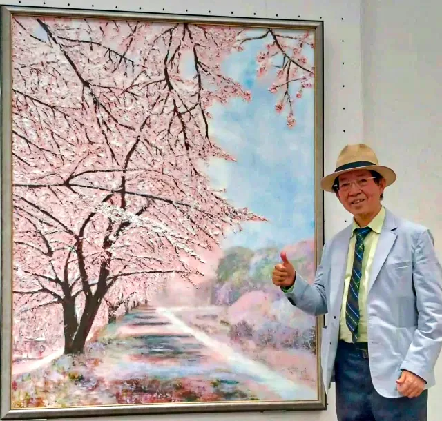 周東寬的油畫「雪降的櫻花徑」,2024年獲得日本內閣總理大臣賞。周東寬提供